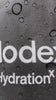 Mixing a Modex drink at the kitchen bench